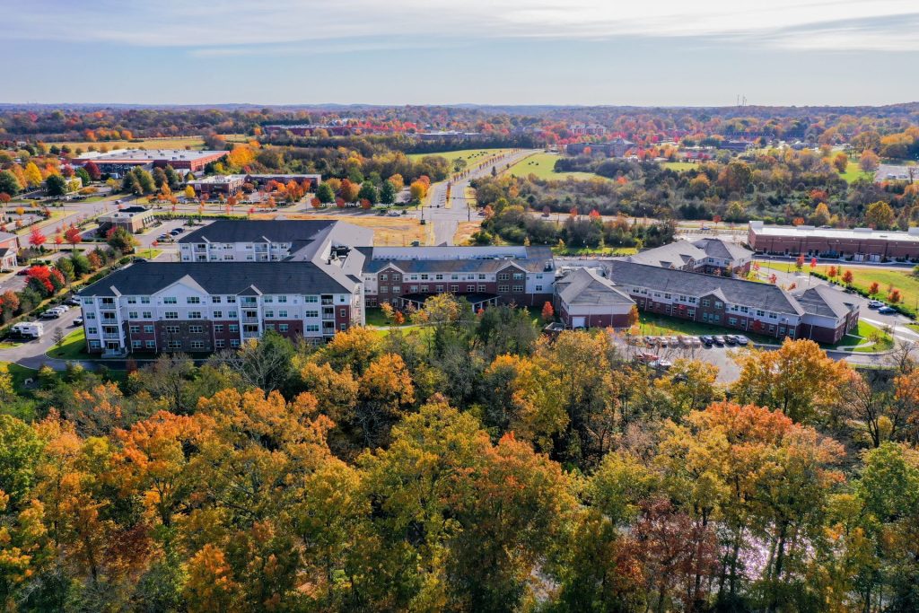 Aerial view of Clarendale at Indian Lake residential community with surrounding autumn foliage.