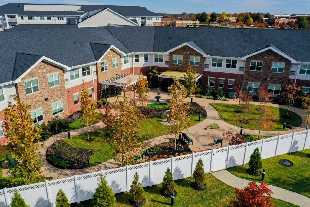 Aerial view of Clarendale at Indian Lake featuring landscaped courtyard and building exterior.