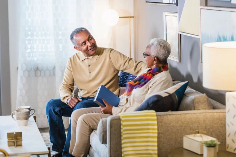 senior couple talking together at home