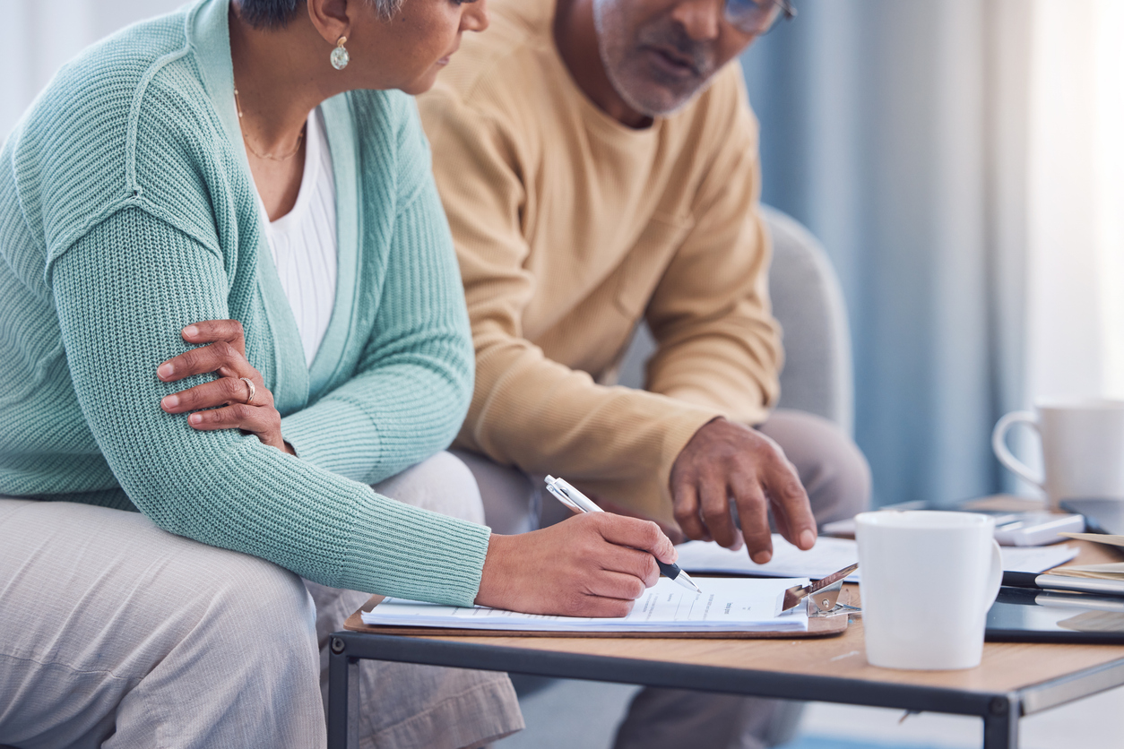 Senior couple writing a will